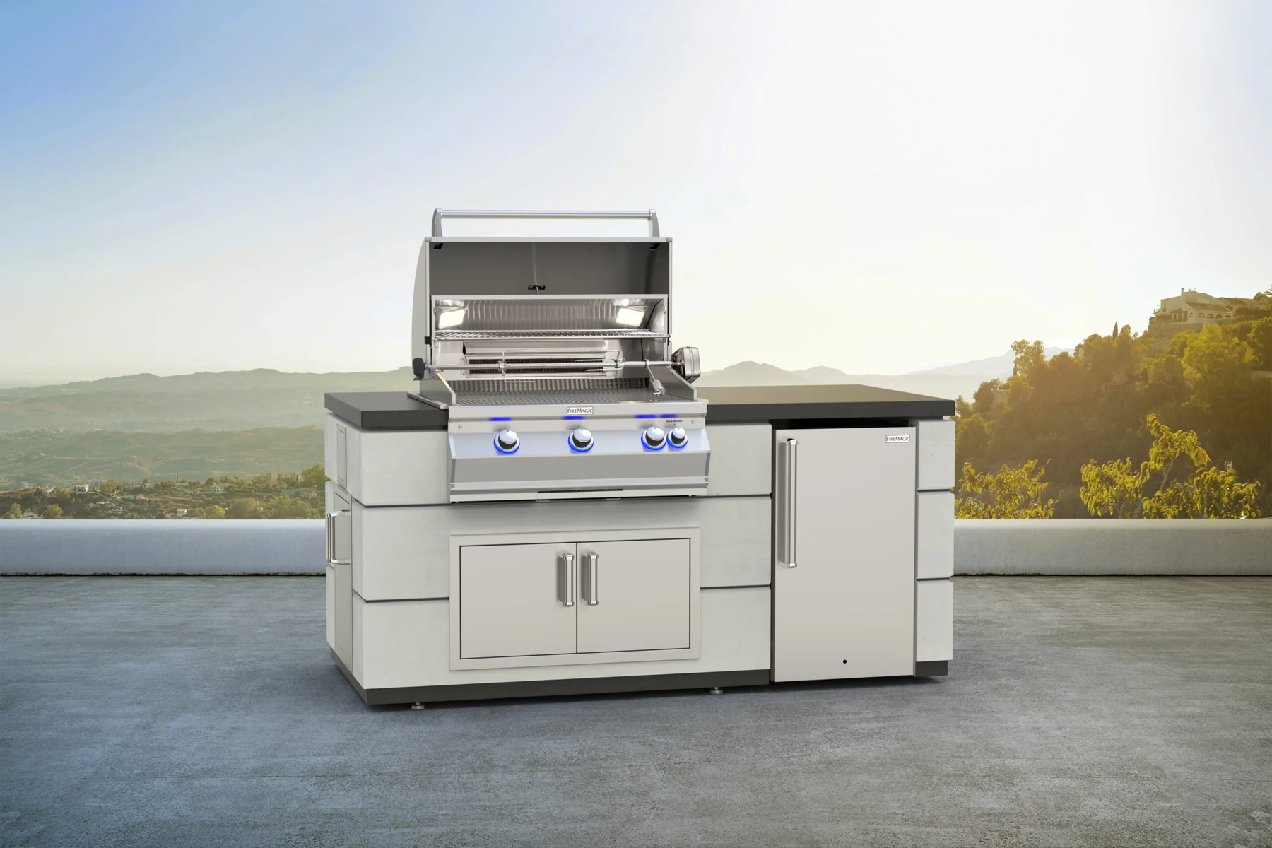 Fire Magic Aurora A660i grill in a finished outdoor kitchen island with refrigerator
