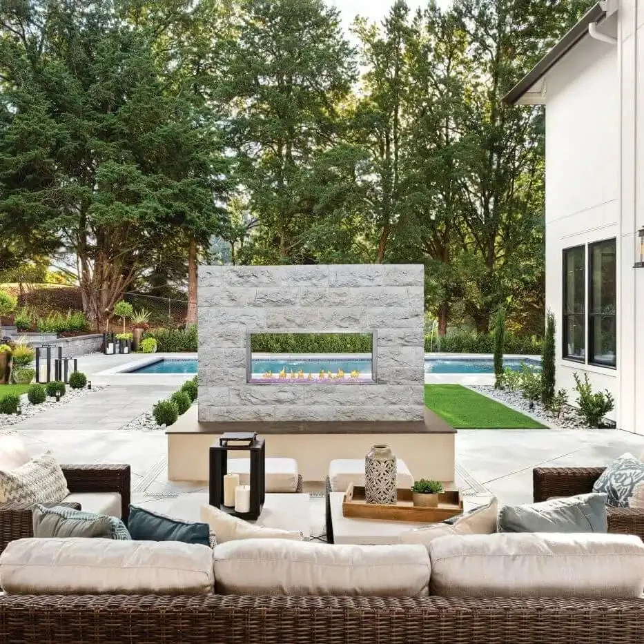 Napoleon Galaxy 50 outdoor gas fireplace in a landscaped patio setting